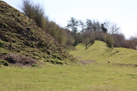 The great bank at the base of the hillfort and the lesser bank below it