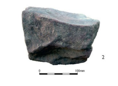 Red sandstone saddle quern piece