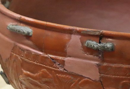 The Samian bowl in the Grosvenor Museum, clearly showing the lead rivets